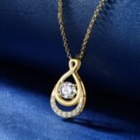 ngled close-up of the GLAMAVERA Elyenne Pendant 1CT moissanite infinity necklace in gold