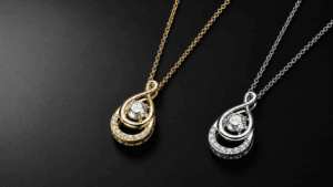 GLAMAVERA Elyenne Pendant necklaces in gold and silver with sparkling moissanite stones on a black background