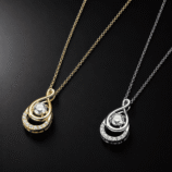 GLAMAVERA Elyenne Pendant 1CT moissanite infinity necklace in gold and silver shown side by side