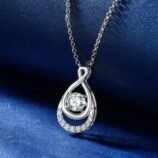 Angled close-up of the GLAMAVERA Elyenne Pendant 1CT moissanite infinity necklace in silver