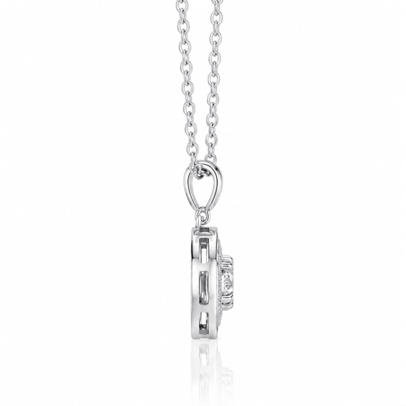 Side profile of the silver Lyrane Halo Pendant Necklace by GLAMAVERA, showing the pendant depth and stone setting
