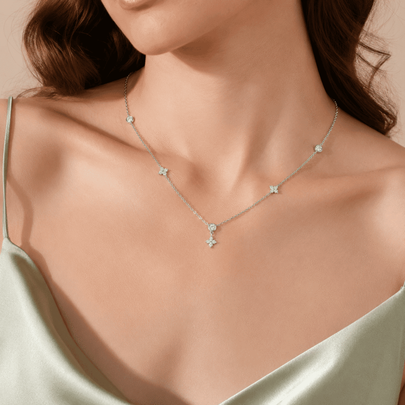 Woman wearing the silver Valenne Clover Choker with delicate moissanite stations by GLAMAVERA