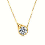 Close-up of the gold Velrose Droplet Necklace with a brilliant round moissanite in a sculptural droplet setting.