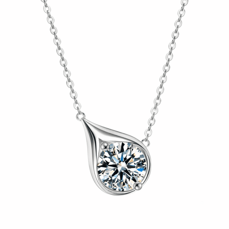glamavera-velrose-droplet-necklace-silver-close-up Close-up of the silver Velrose Droplet Necklace with a brilliant round moissanite in a sculptural droplet setting.