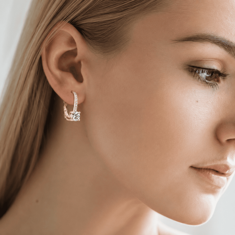 rivane-drops-gold-moissanite-earrings-lifestyle Woman wearing Rivane Drops gold-tone moissanite leverback earrings