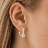 Rivane Drops gold-tone moissanite leverback earring worn on the ear