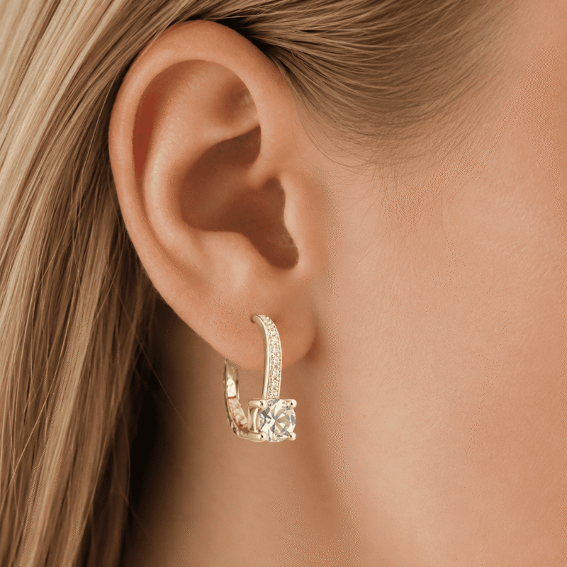 rivane-drops-gold-moissanite-earrings-on-ear Rivane Drops gold-tone moissanite leverback earring worn on the ear